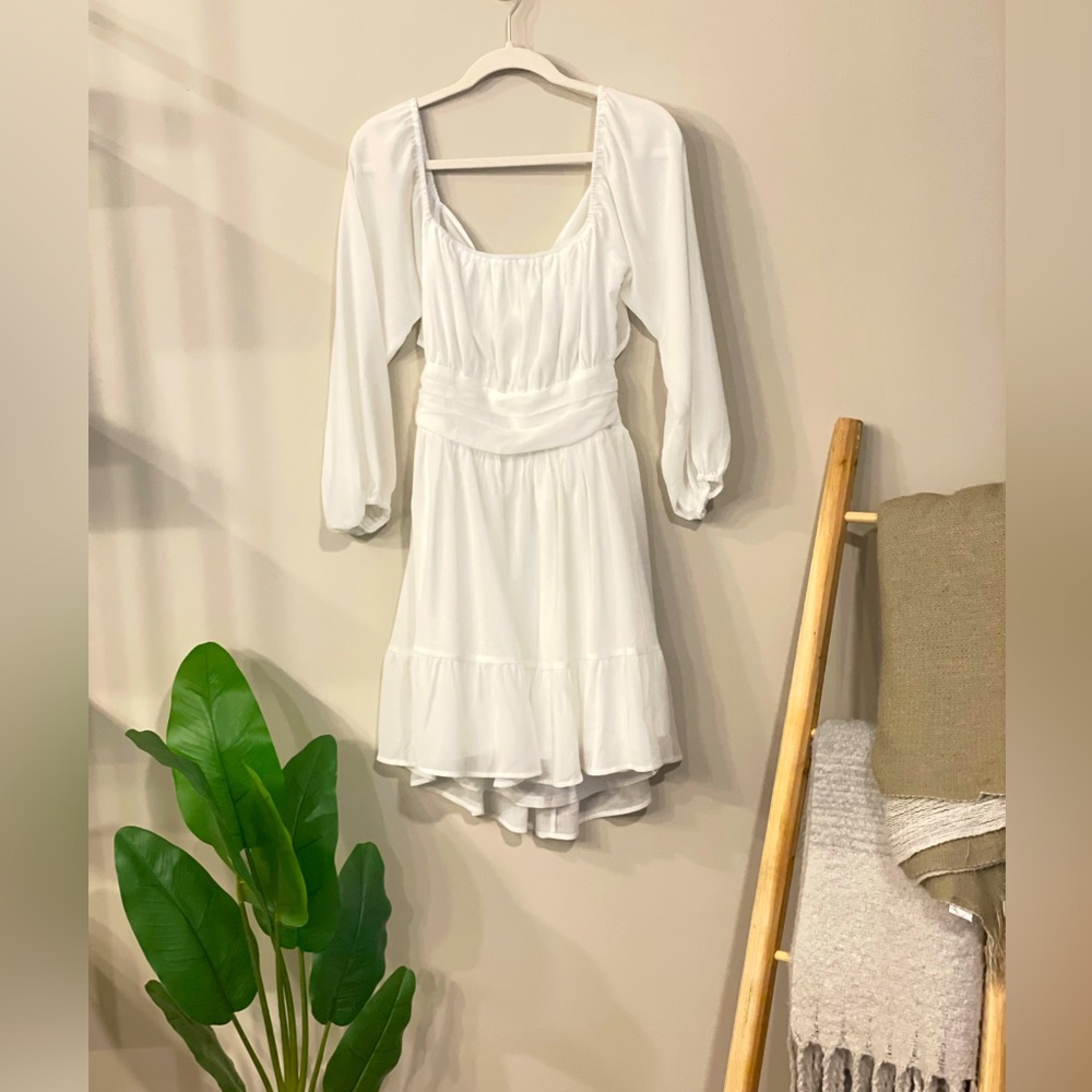 NWT. Women’s dress with tie back. Size L. Color White.